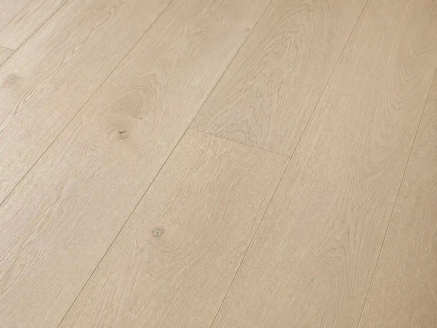 Close-up of wire-brushed hardwood flooring raised grain texture