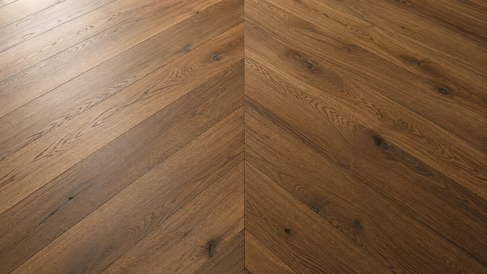 Wide-plank chevron hardwood flooring in warm oak finish