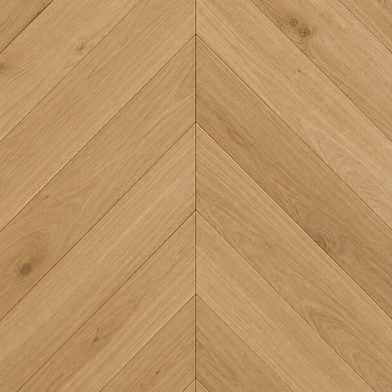 Close-up of European oak chevron hardwood flooring showing 45-degree mitered planks meeting point-to-point in clean V-shaped lines