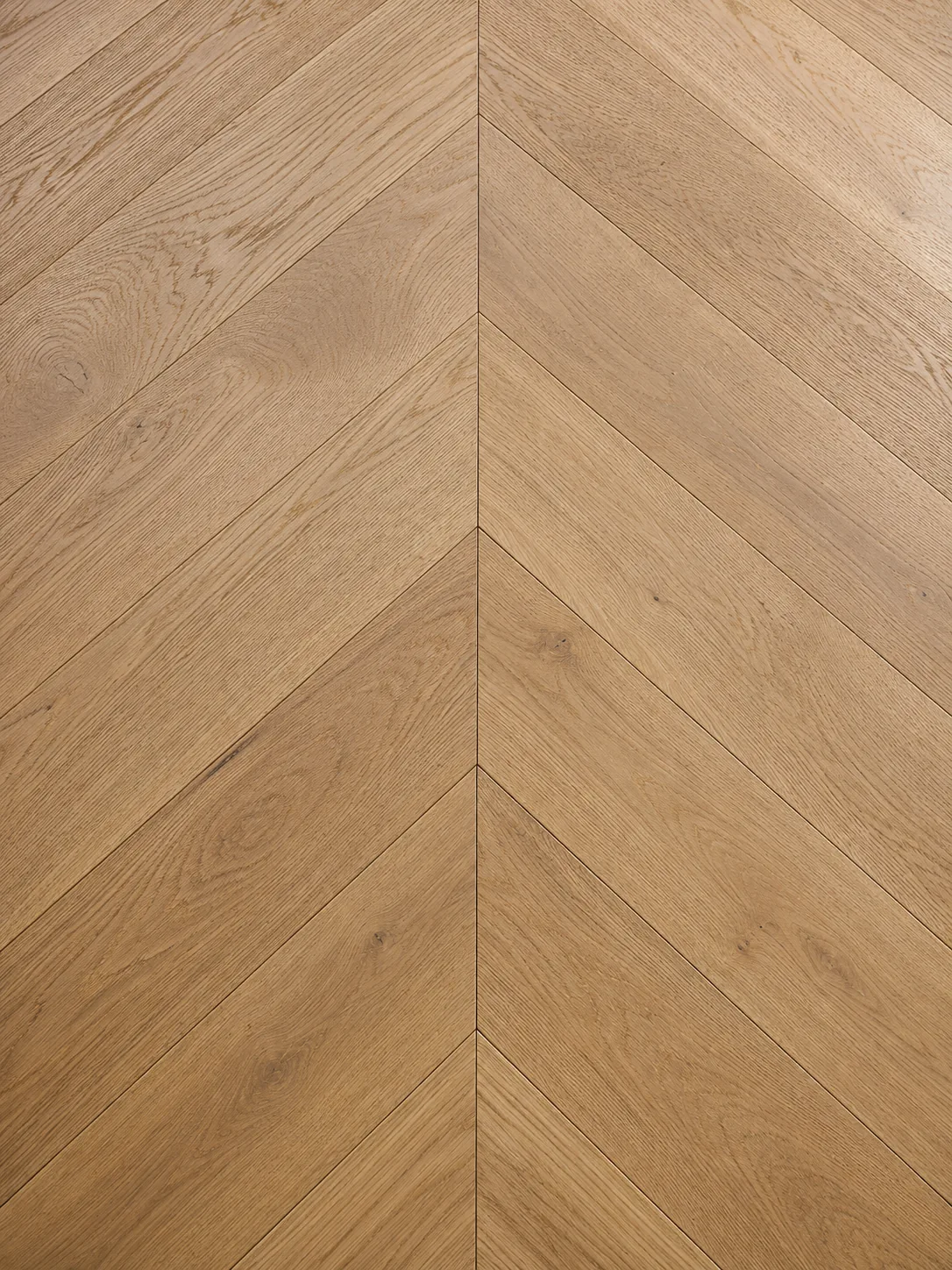 European oak chevron hardwood flooring with 45-degree mitered planks and continuous V-shaped lines