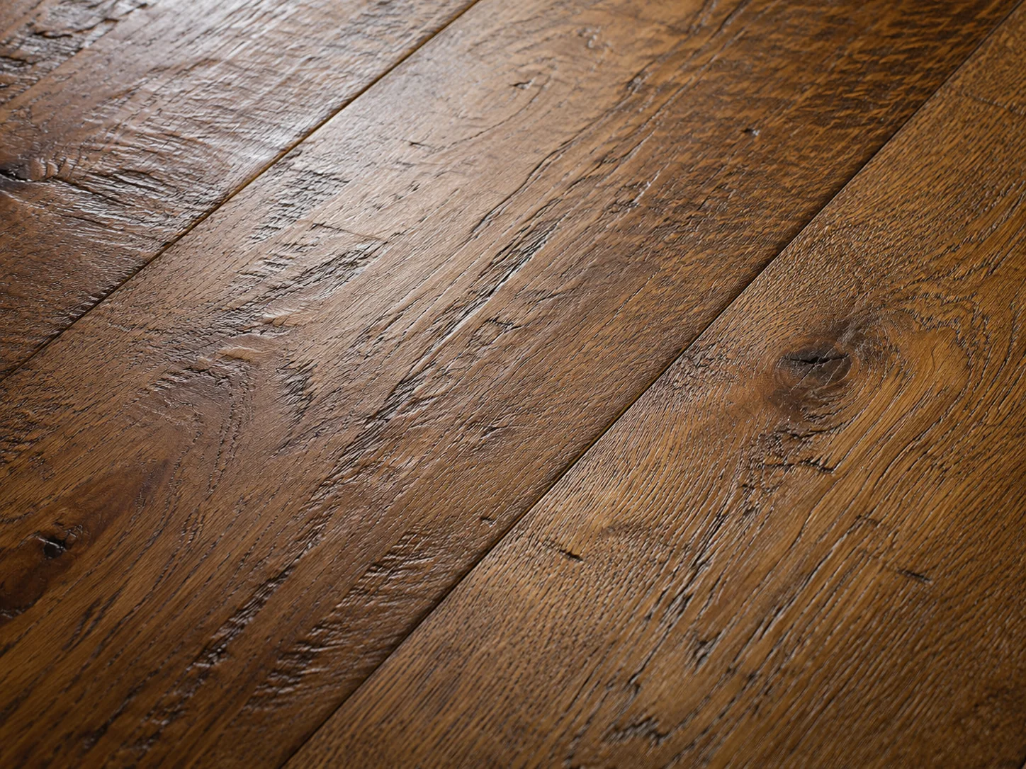 Close-up detail of hand-scraped hardwood flooring texture