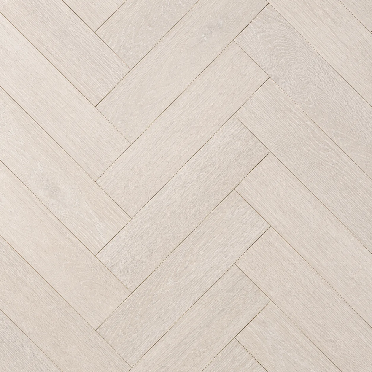 Close-up detail of herringbone hardwood flooring pattern